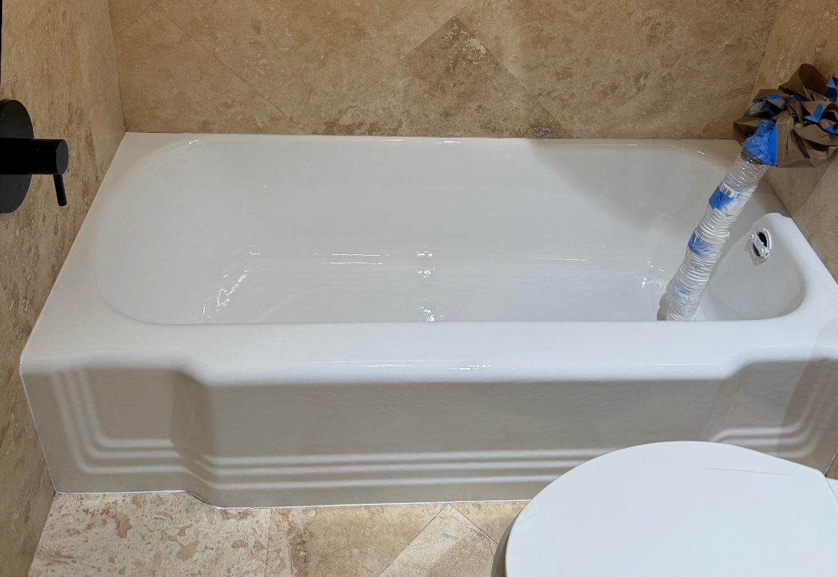 Pink tub in a travertine bath — after