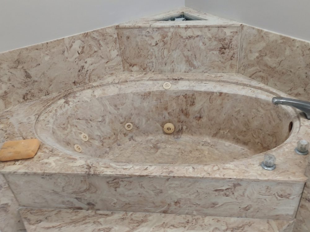 Cultured-marble corner spa in its original color