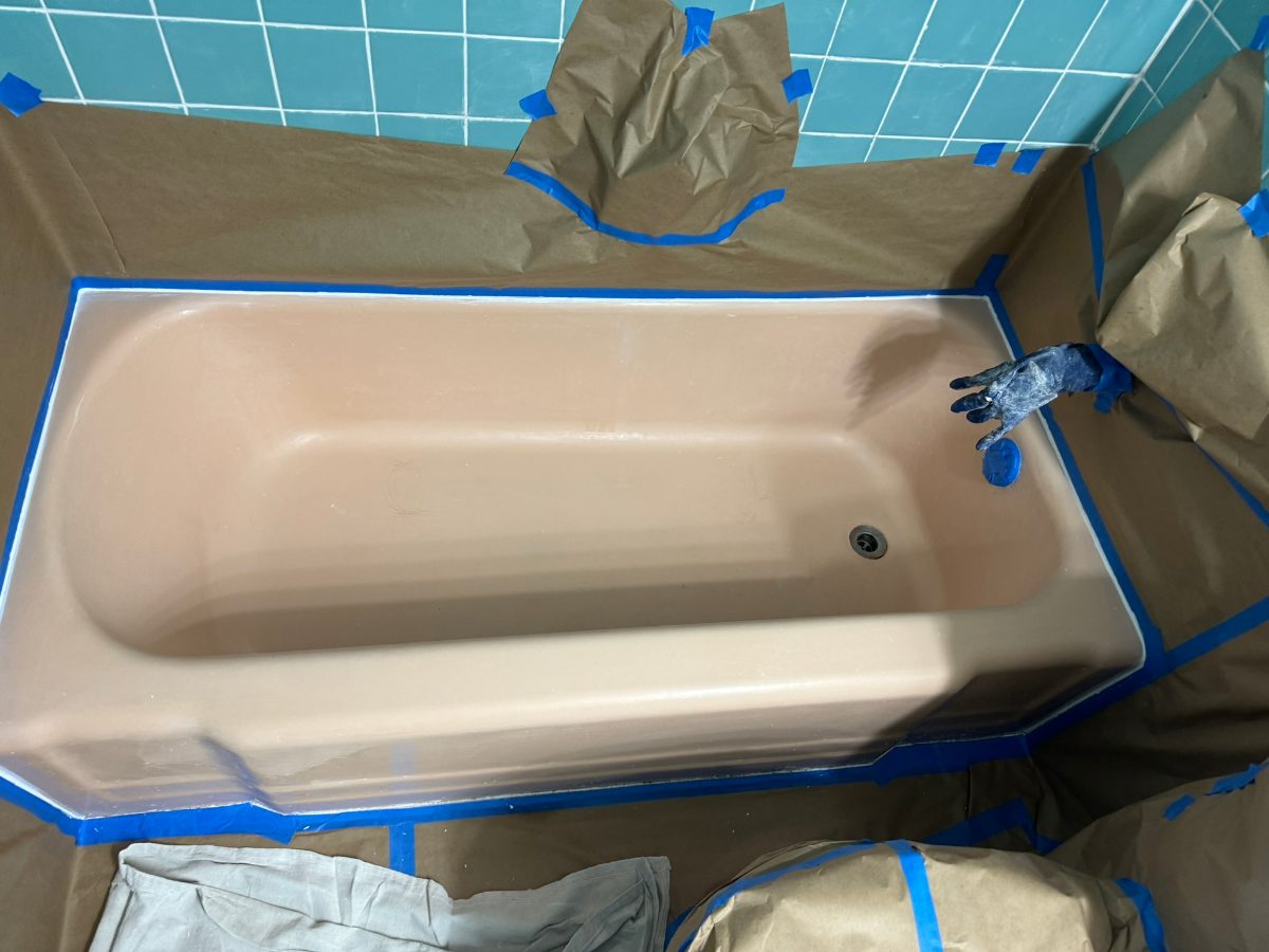 Stripped & refinished in a teal-tile bath — before