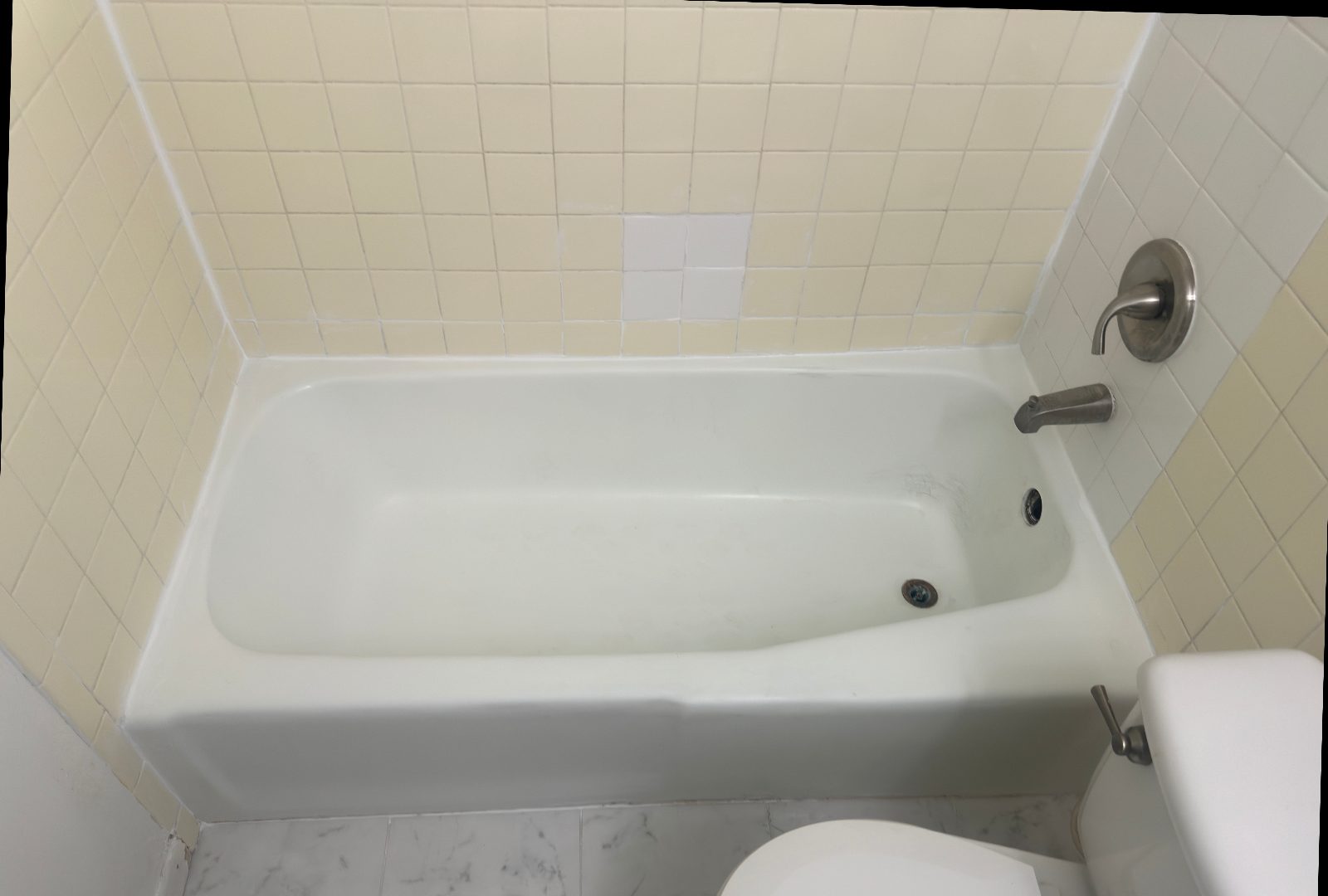 Yellowed tile & tub, made new together — before