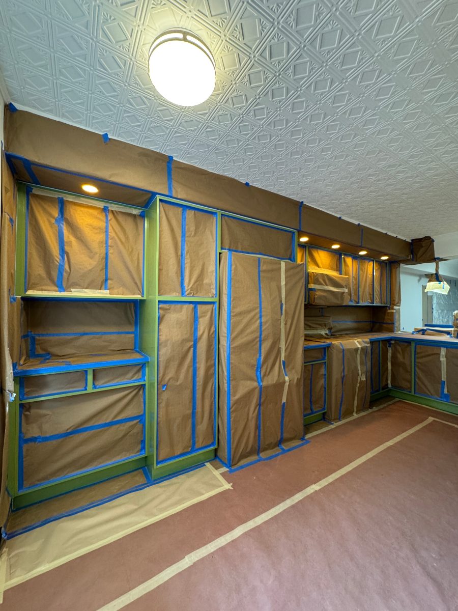 A kitchen fully masked and prepped for cabinet spraying
