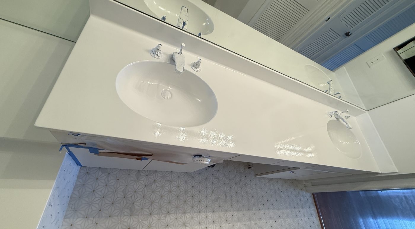 The same double-sink vanity unwrapped, glossy white and ready to use