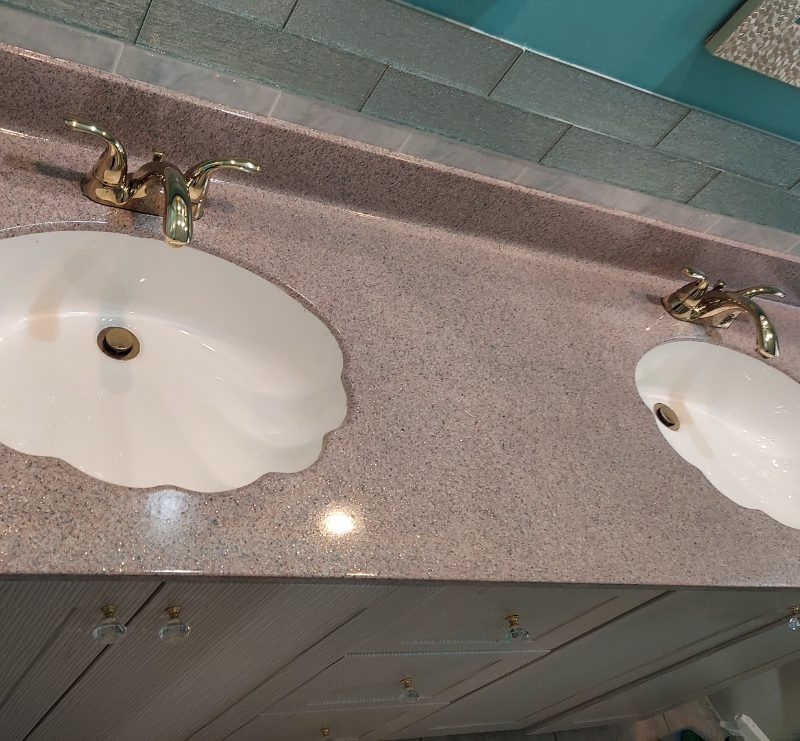 Double vanity countertop refinished in a warm granite-imitation finish